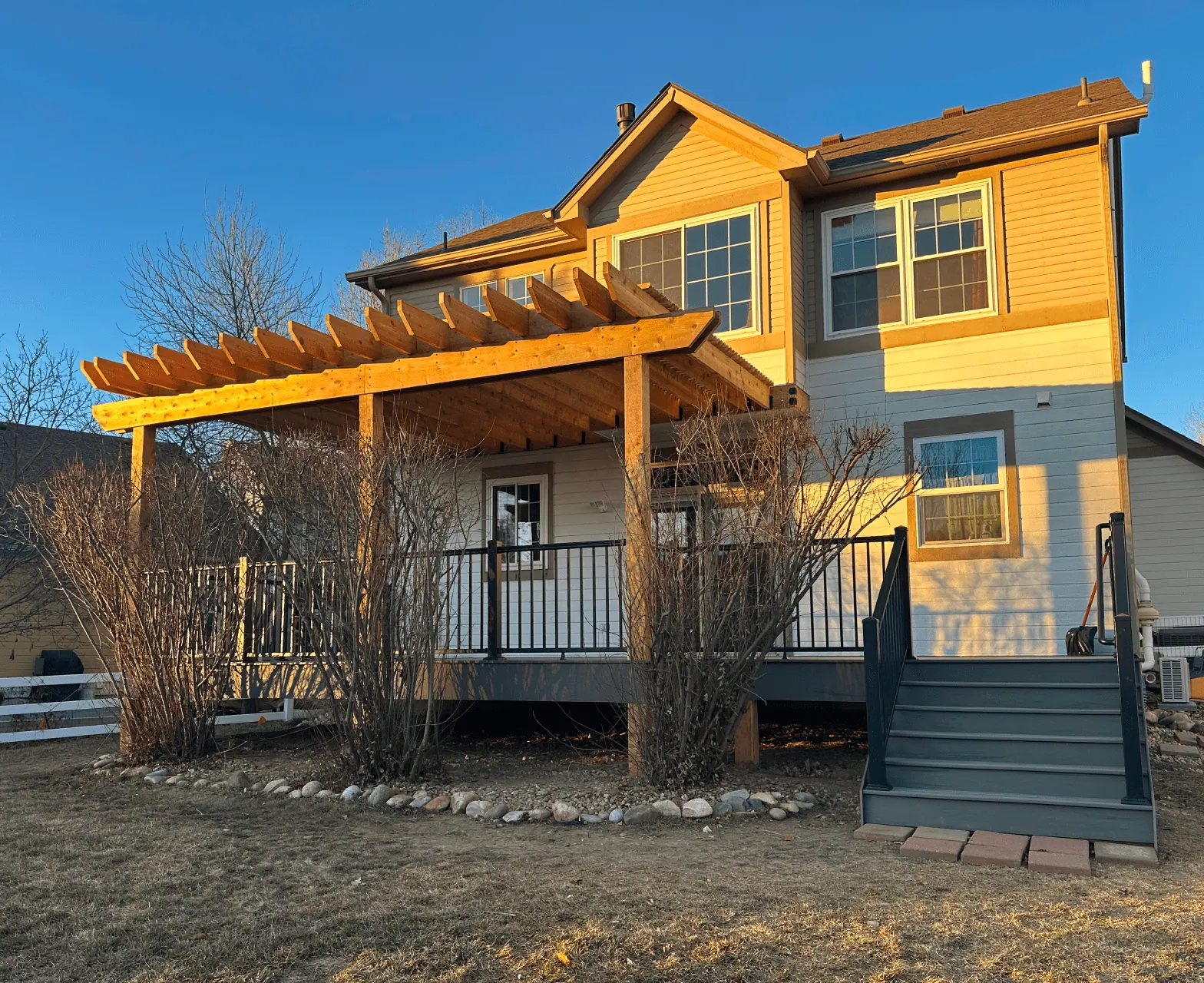 Deck with stairs featuring a pergola
